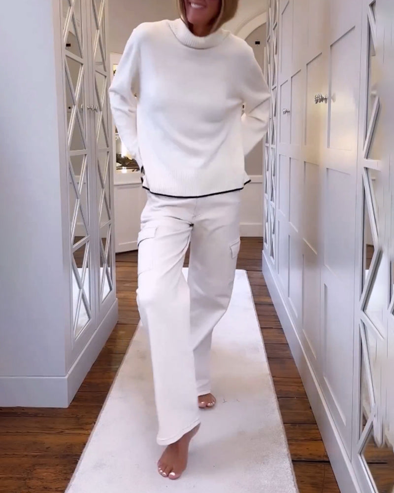 Pull avec le cou haut et les manches longues