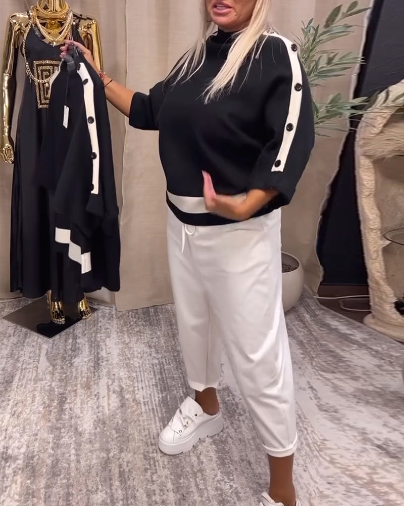 Pull boutonné color block